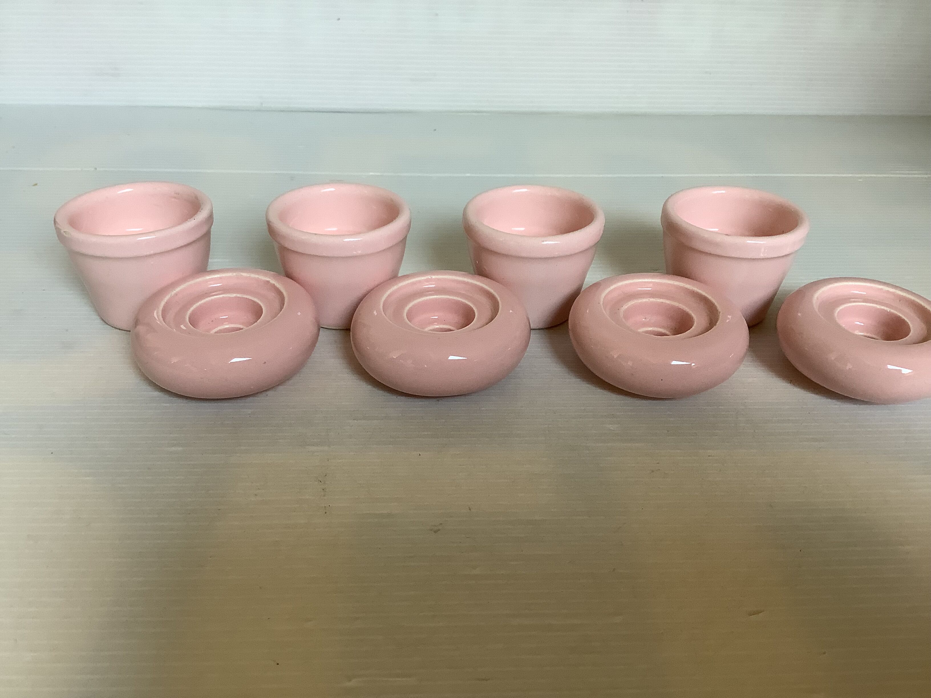 Four double pink candlesticks
