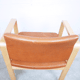 Fauteuil en cuir et en bois 1990