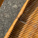 Wicker and black wrought iron armchair