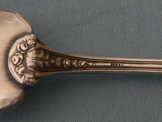 SFAM silver metal salad servers.