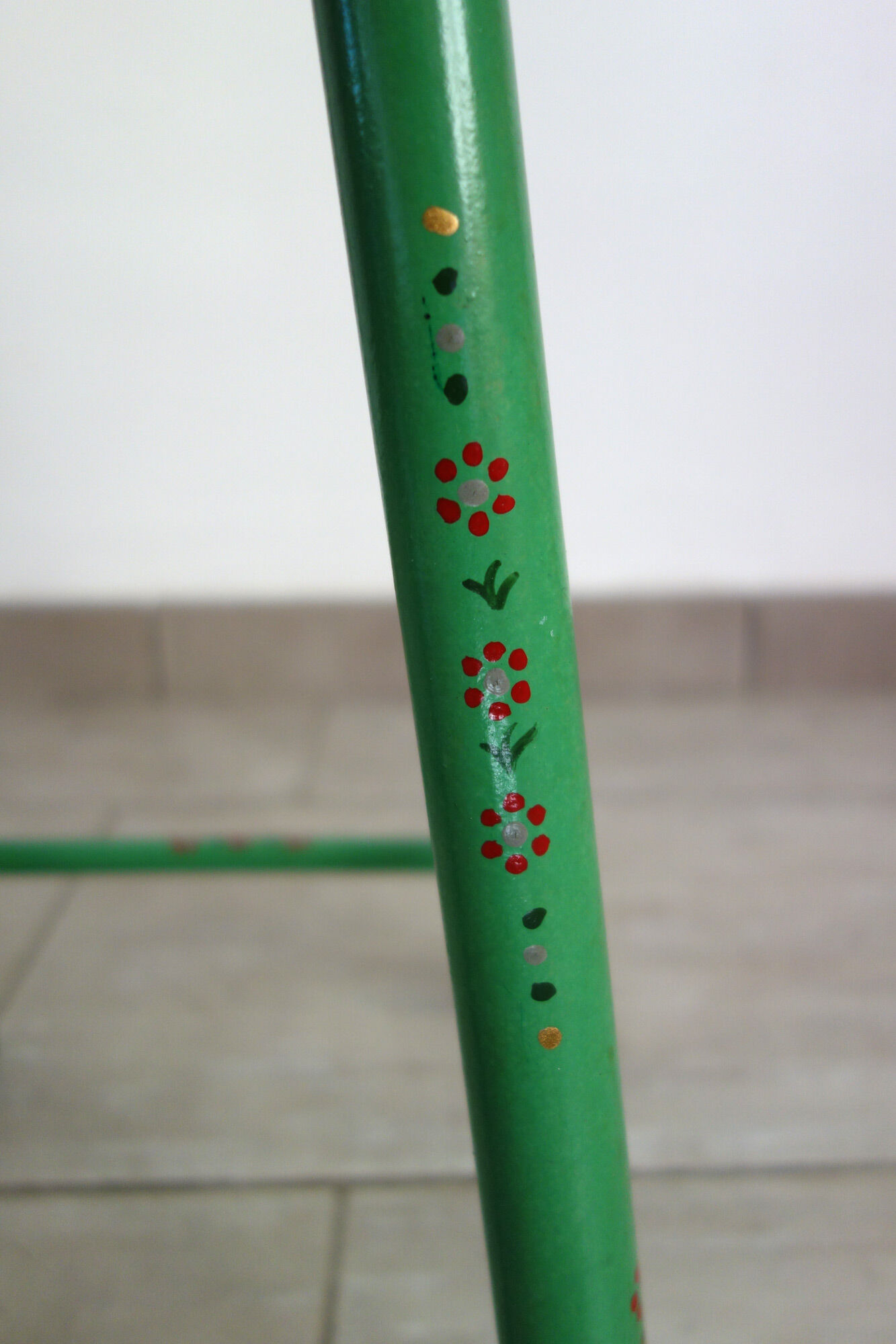 Old painted and decorated wooden stool