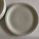 Set of 7 Scandinavian modernist flat plates in ivory earthenware