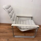 Pulkka armchair by Ilmaria Lappalainen and its ottoman