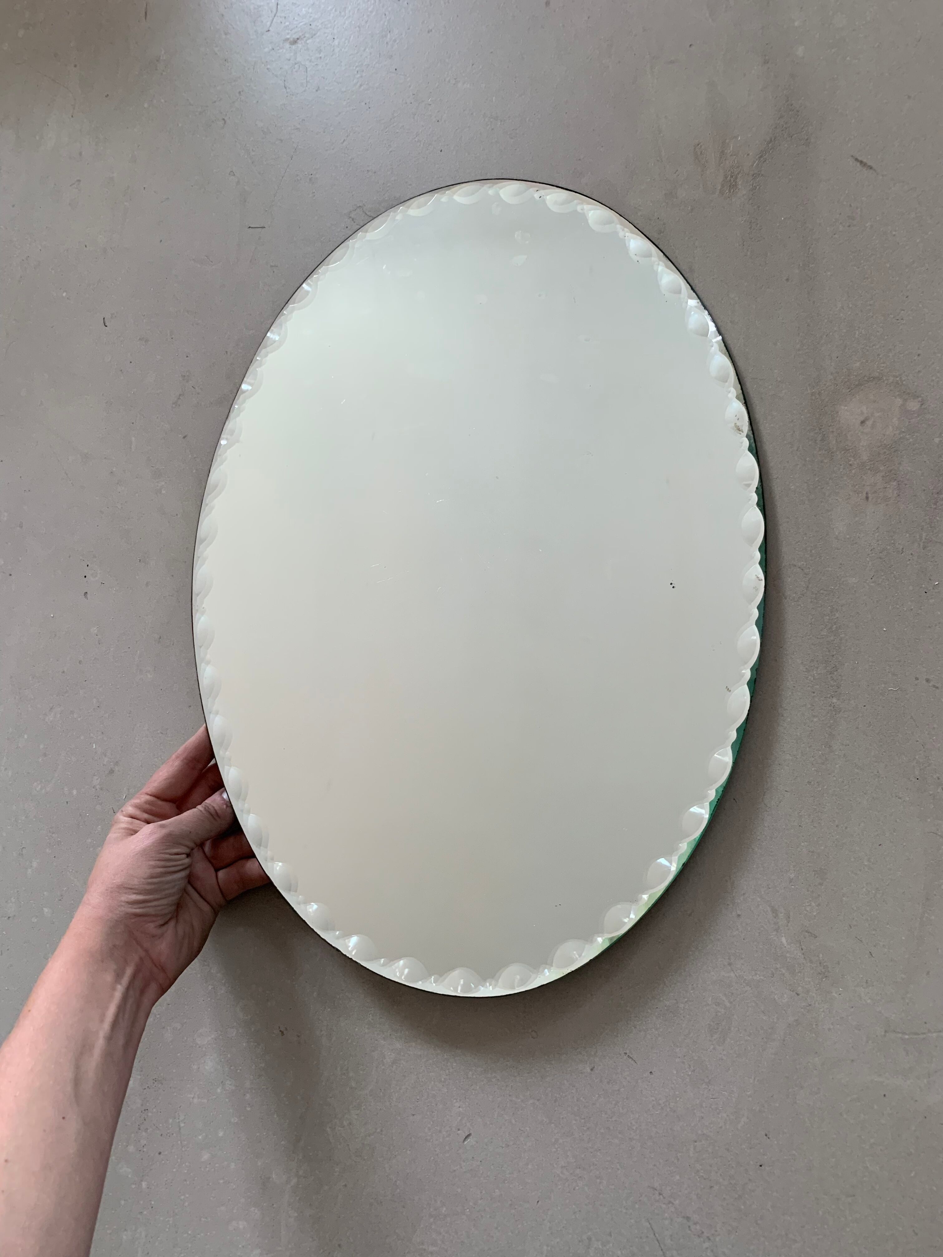 Old beveled oval mirror