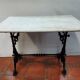 bistro table with cast iron base and marble top
