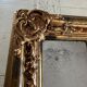 Miroir Louis XV, glace au mercure et bois doré, XIXe