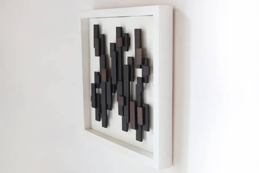 Three-dimensional framed artwork in wenge wood by Studio Aik