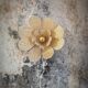 Flower wall light made of rattan and raffia petals