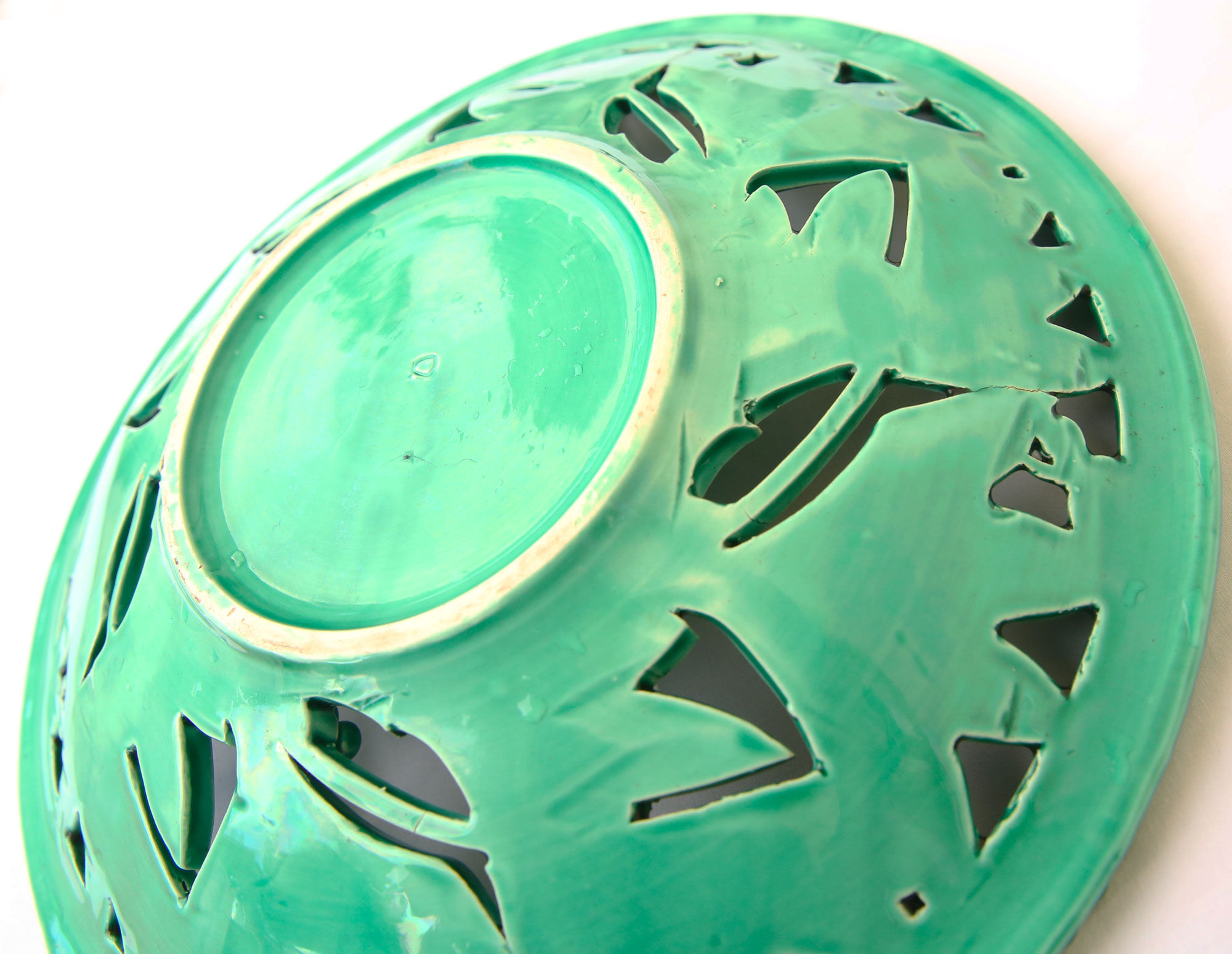 Openwork XL dish in green slurry like olive branches