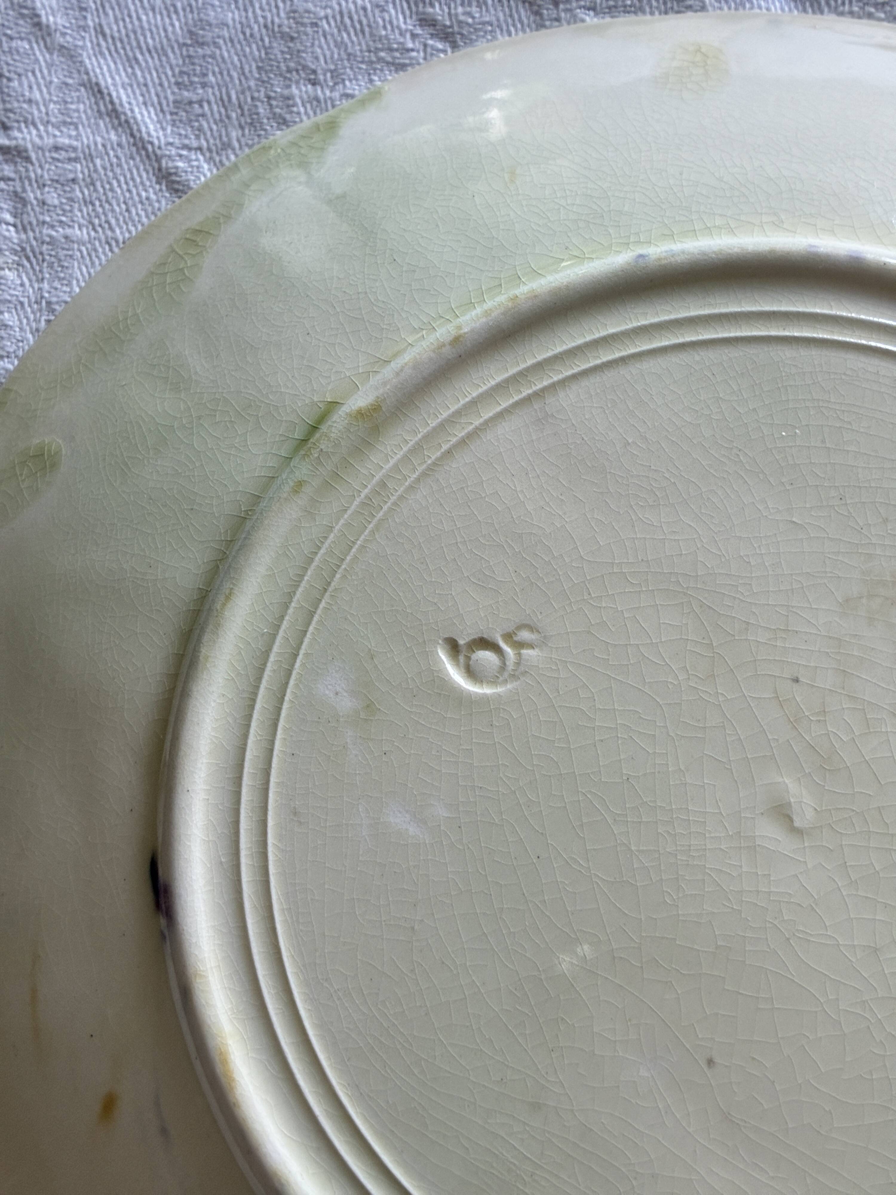 Lot of 4 Onnaing barbotine plates with grapevine design.