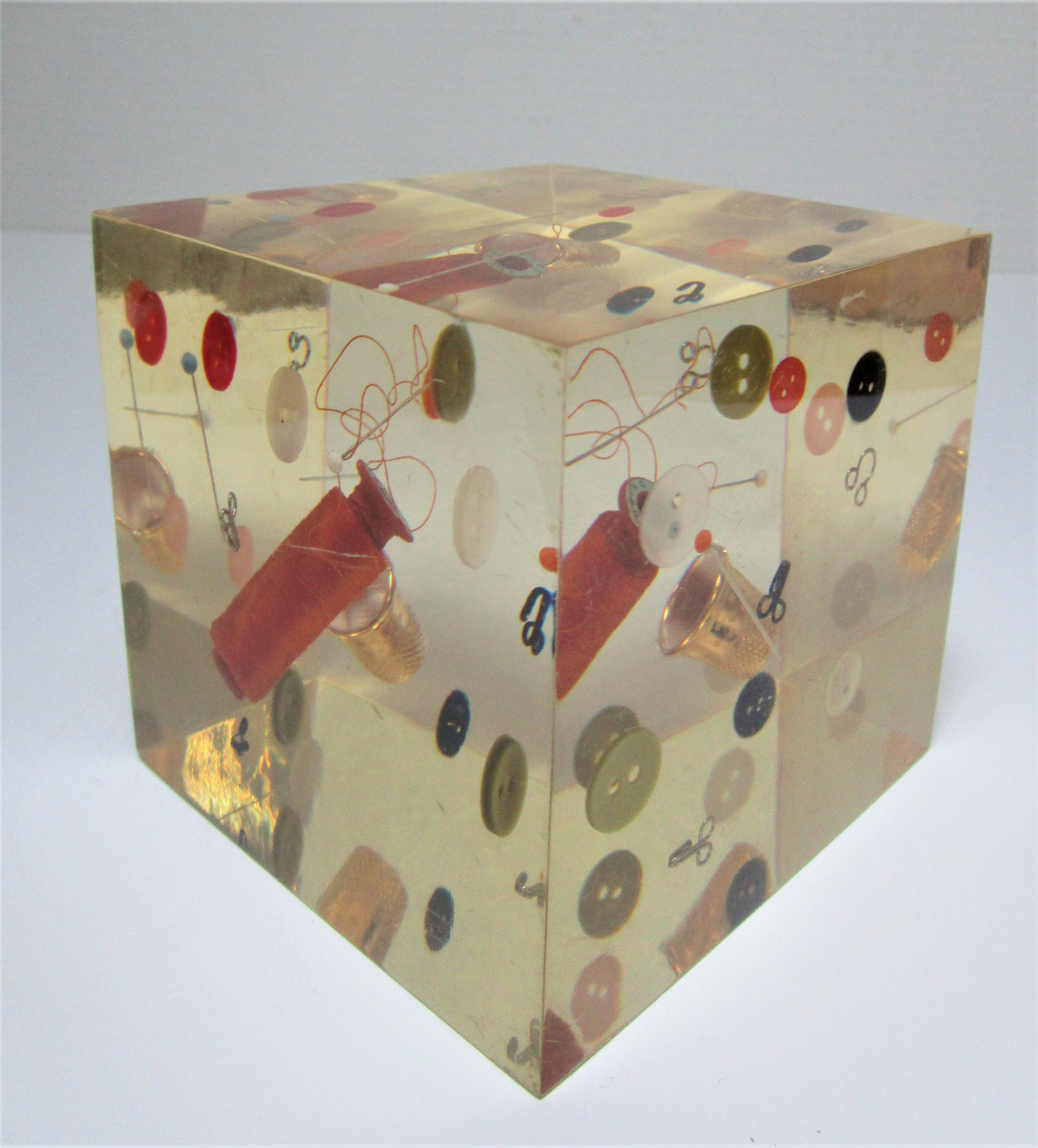 Paperweight sculpture block resin inclusions sewing design 70s
