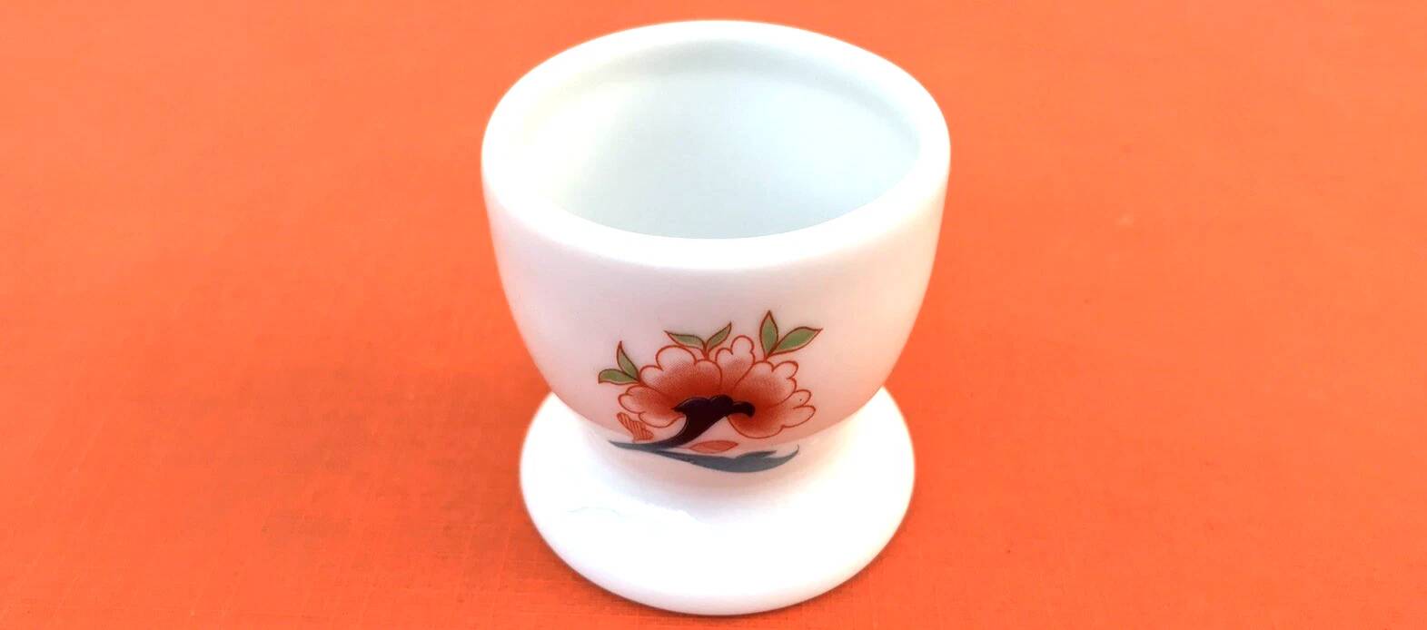 Ulysse Paris porcelain egg cup for Chanill with floral decoration.