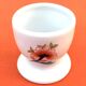 Ulysse Paris porcelain egg cup for Chanill with floral decoration.