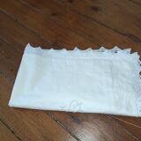 Ancient monogrammed pillowcase adorned with cotton lace