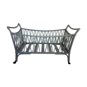 Rattan child bed on wheels