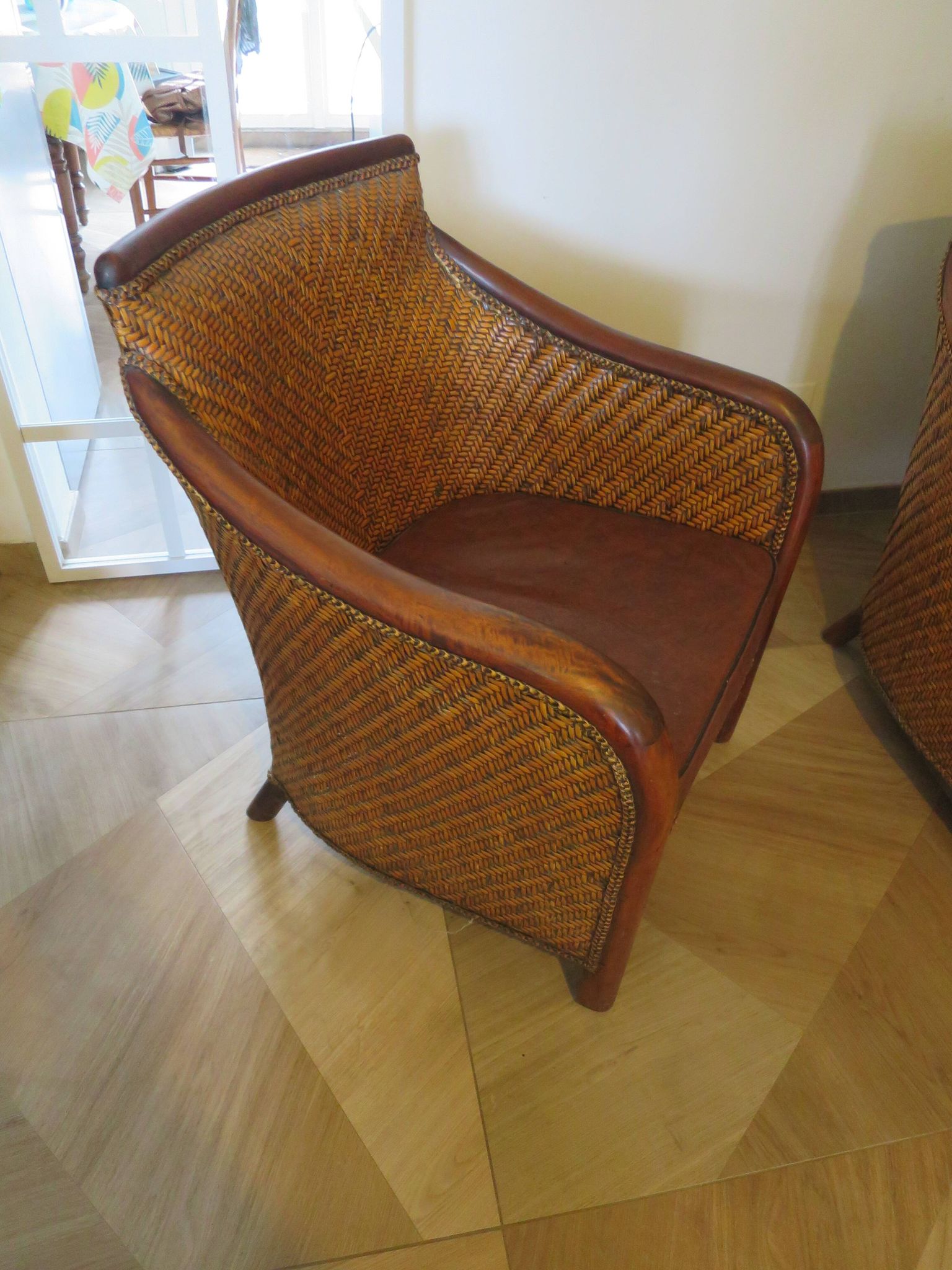 Woven rattan armchair and exotic wood in colonial style, 1980s.