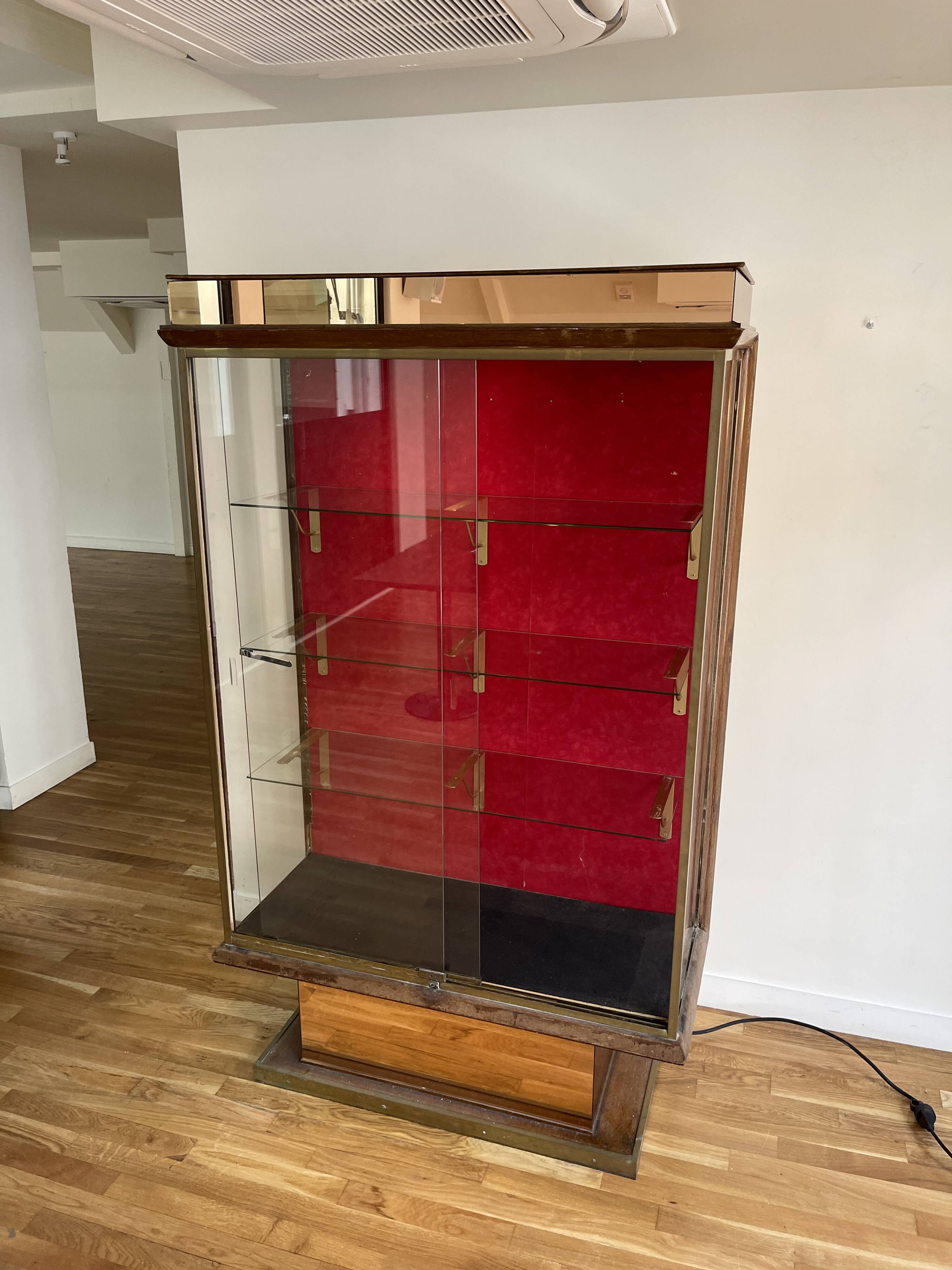 Brass display case from the Lutetia hotel with integrated lighting.