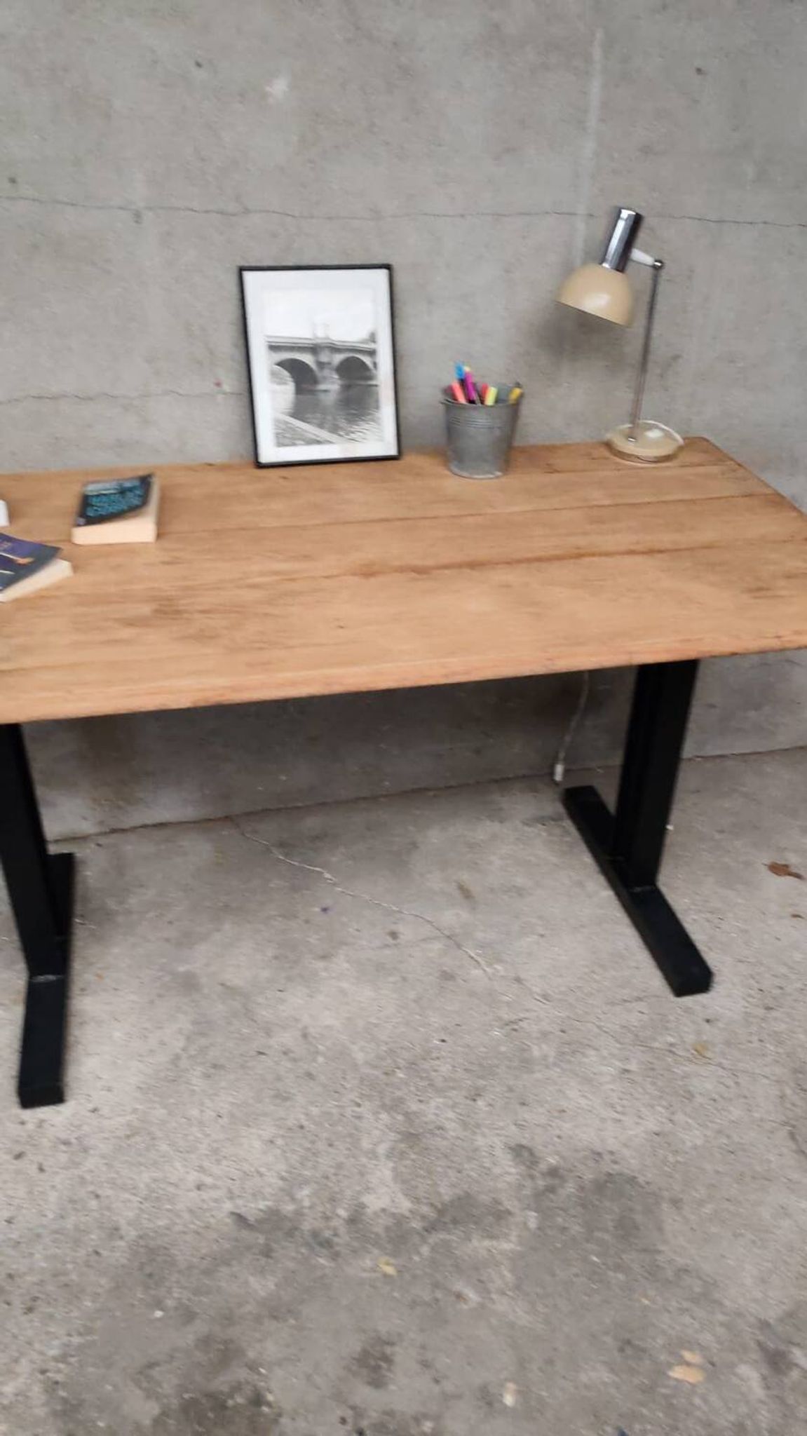 Unique wooden table with metal industrial legs.