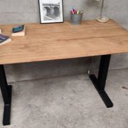Unique wooden table with metal industrial legs.