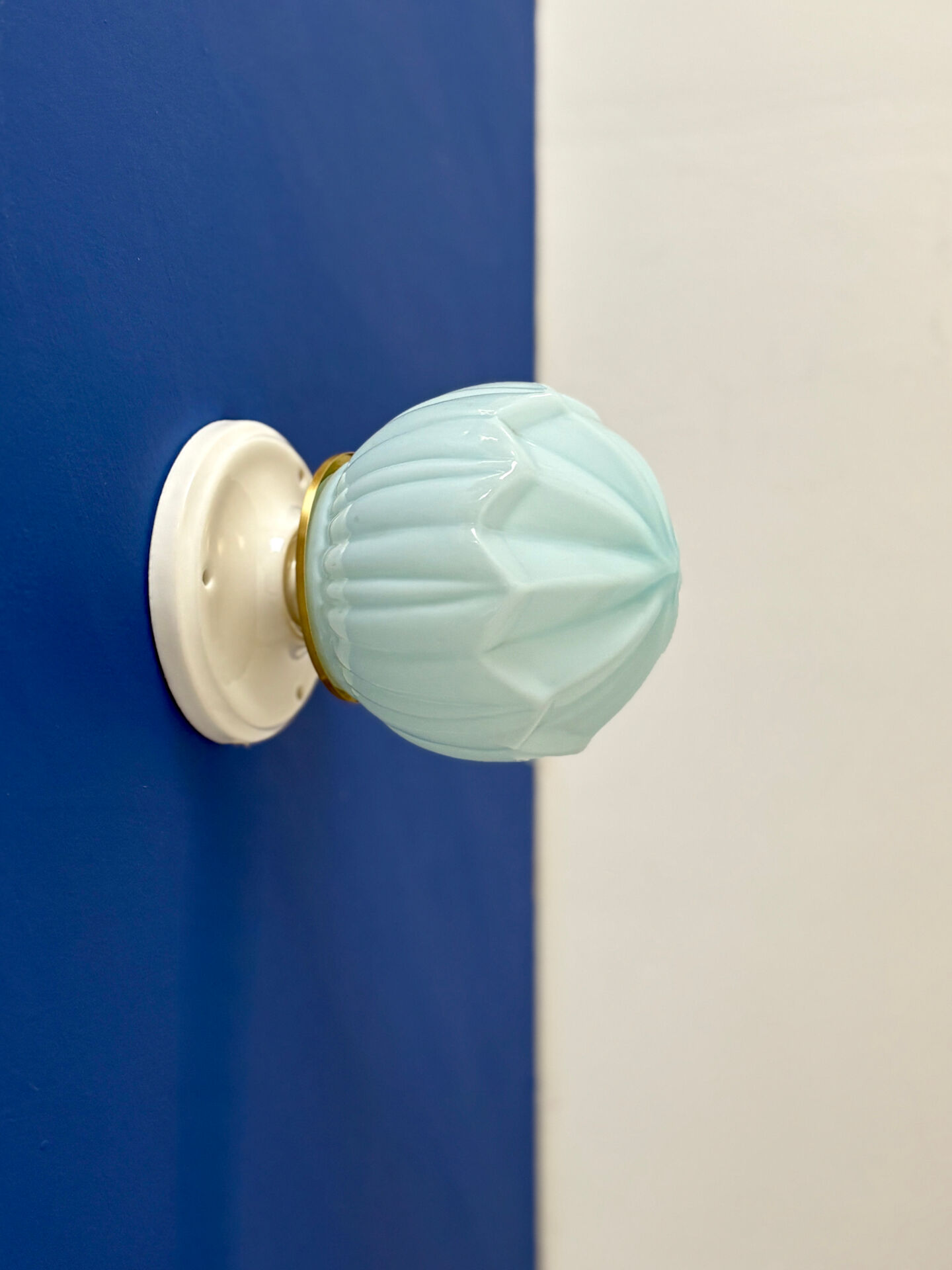 Vintage Art Deco globe wall light in blue opaline.