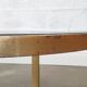 Superb trundle table round golden and smoked glass