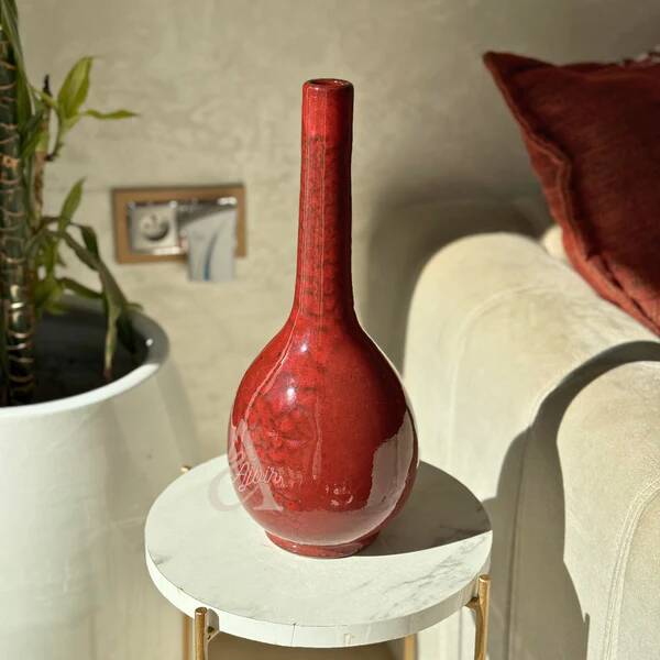 Handcrafted curved bottle vase in Bordeaux.