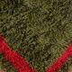 Handmade pure wool rug in green and red, size 140/260 cm.