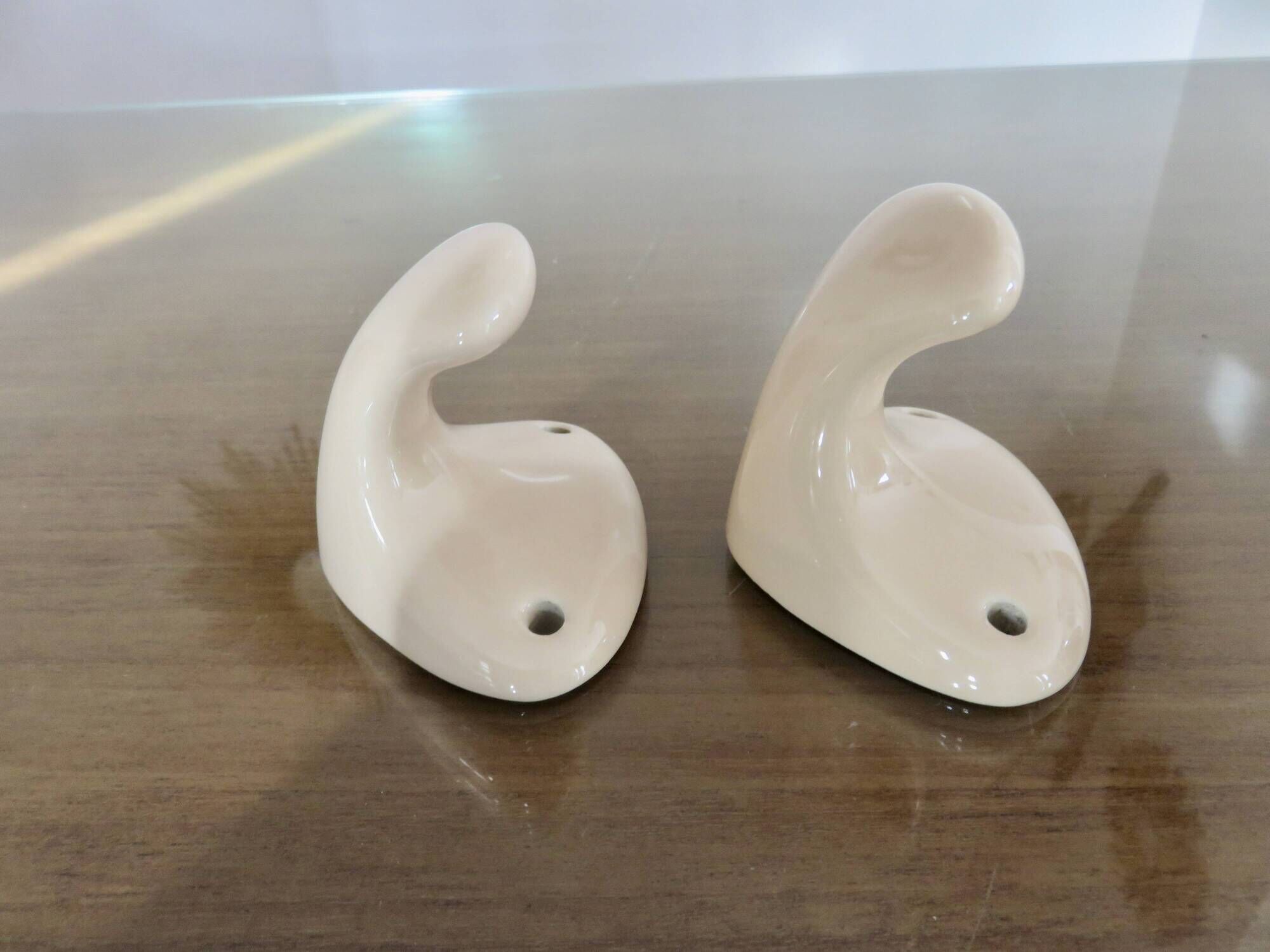 Pair of salmon-colored art deco porcelain hooks from the 30s and 40s