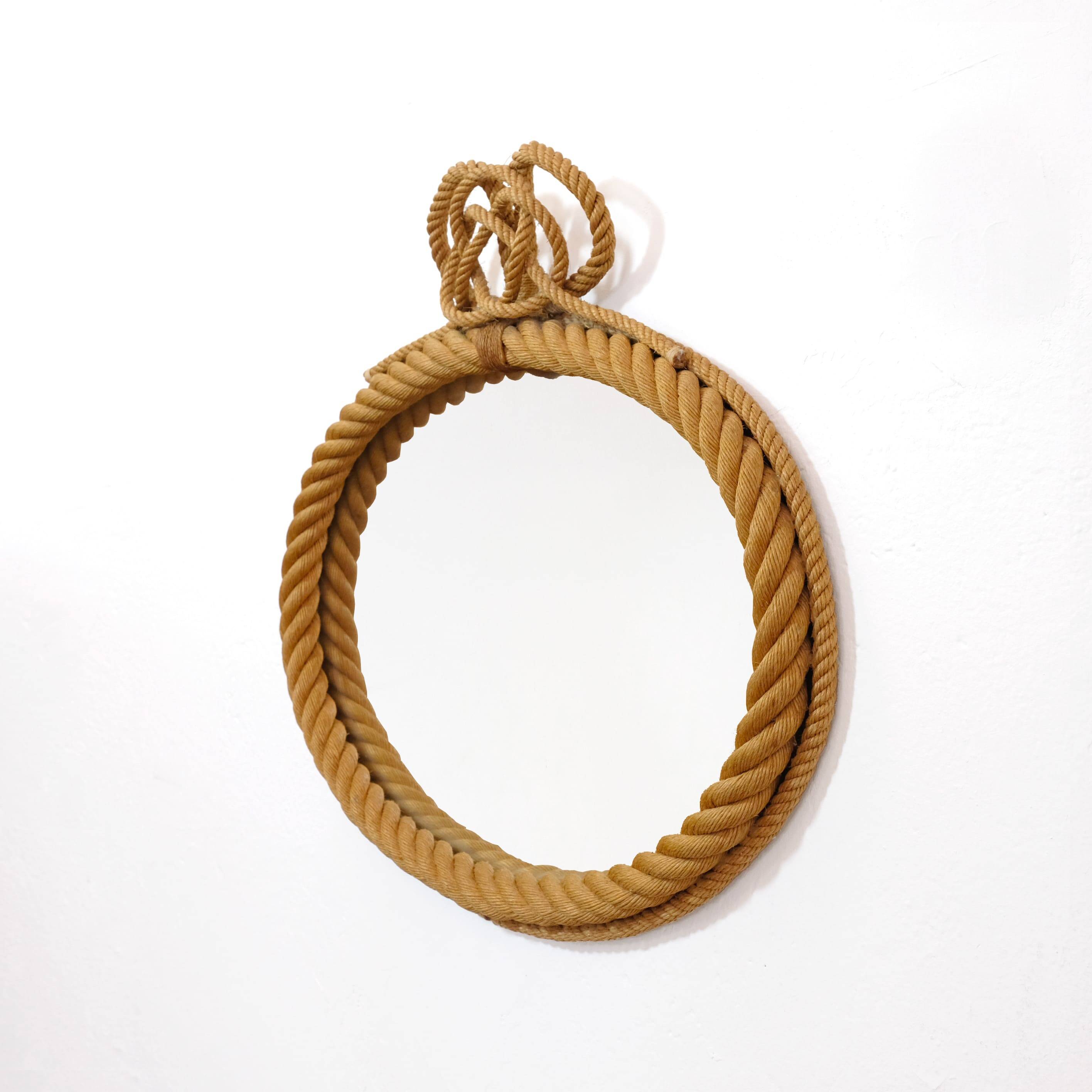 Large oval mirror in rope with pediment, 64cm x 56.5cm.