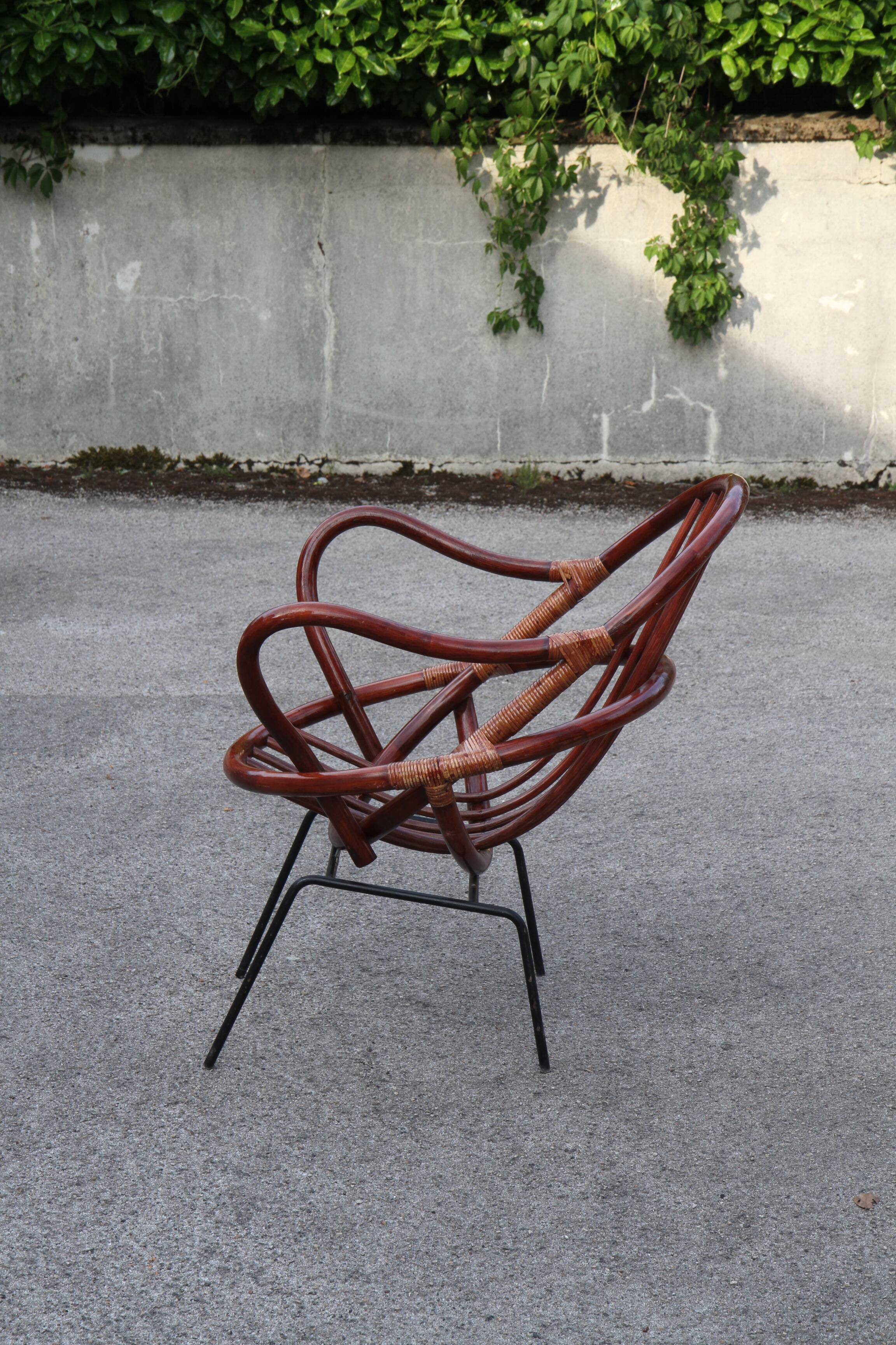 Rattan shell armchair with metal feet