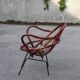 Rattan shell armchair with metal feet