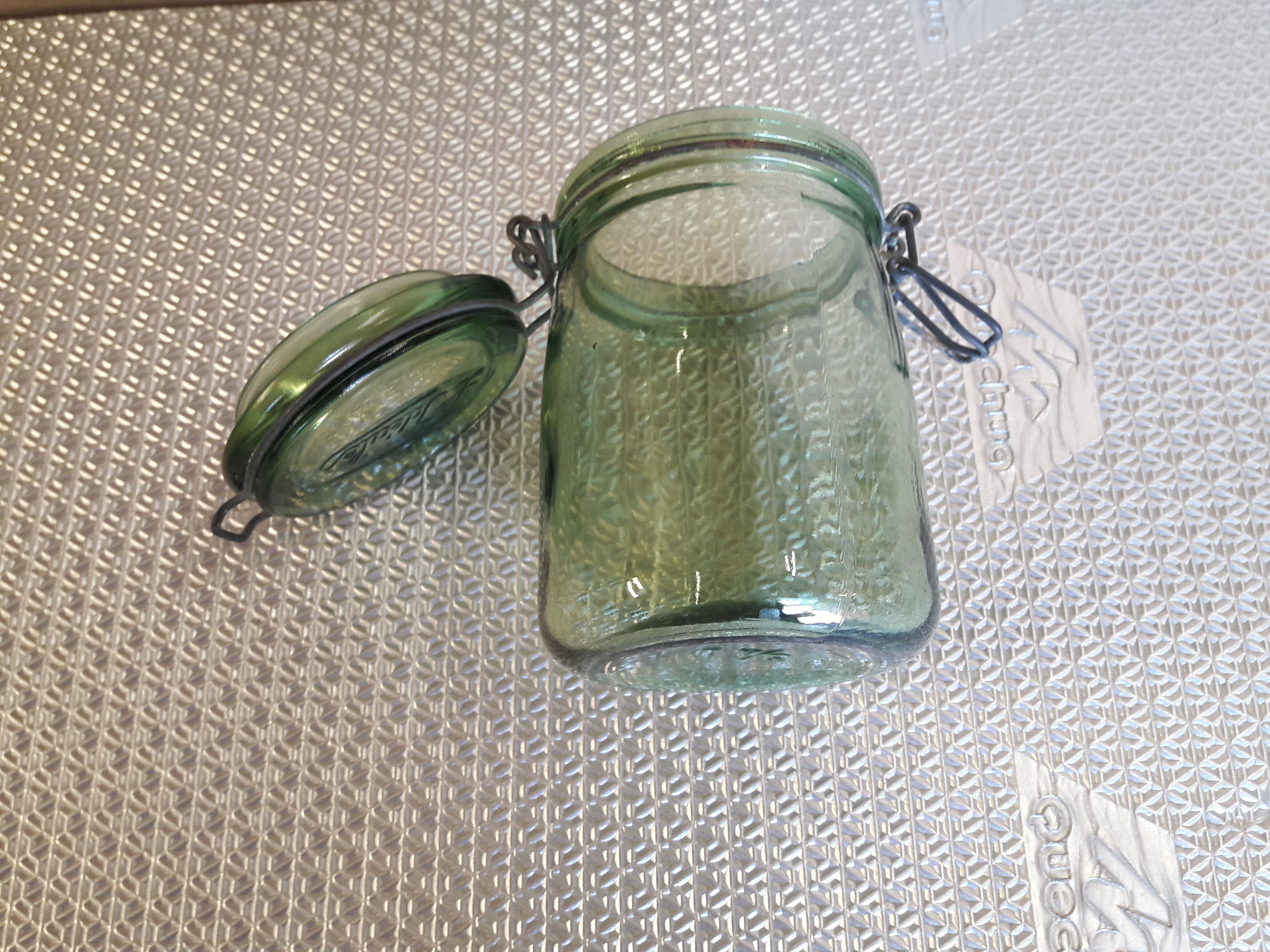Green glass jar l l 'ideal