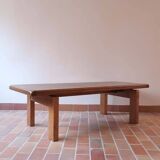 Large solid retractable coffee table