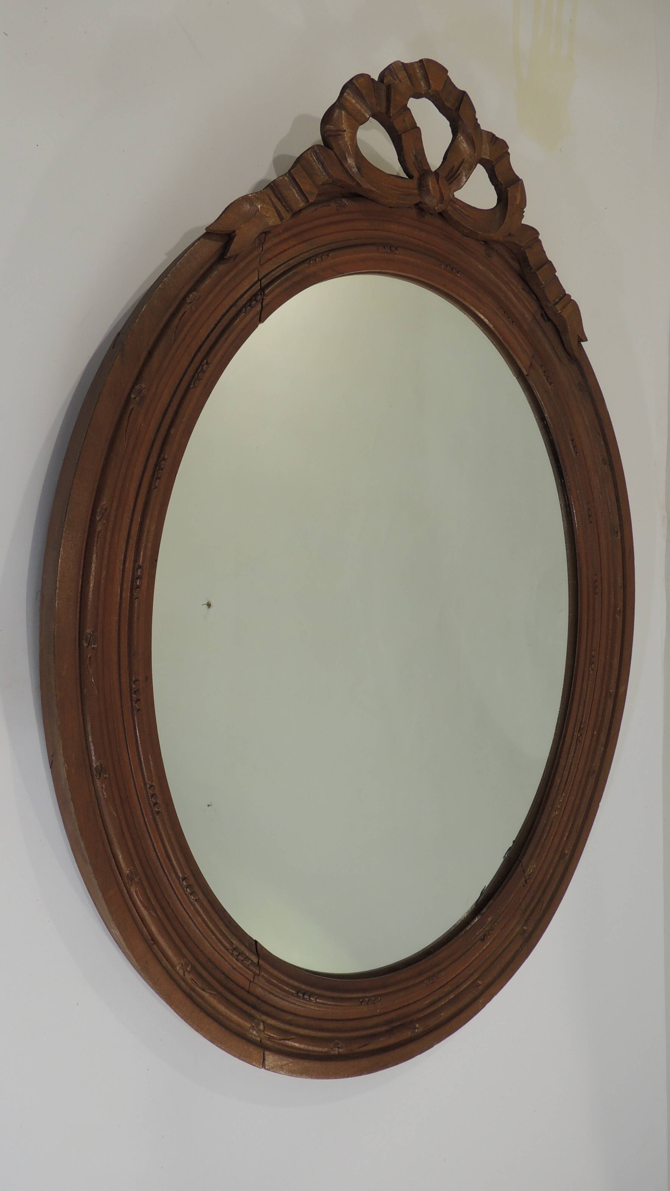 Antique oval mirror in carved wood – Louis XVI style, ribbon bow decoration, mid