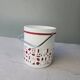 Vintage white opaline ice bucket with red patterns.