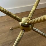 Round tripod designer coffee table in brass