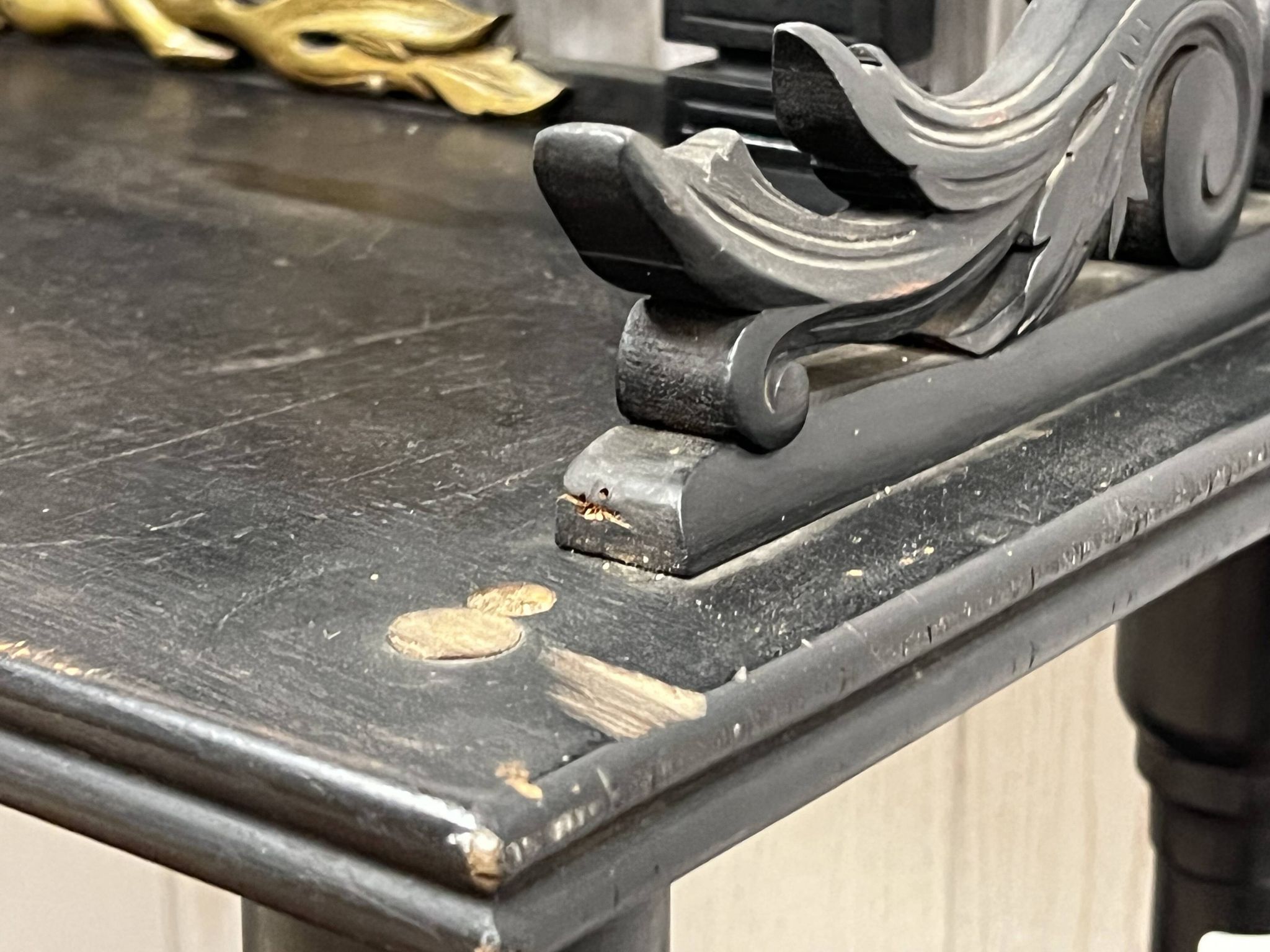 Blackened wooden shelf.