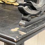 Blackened wooden shelf.