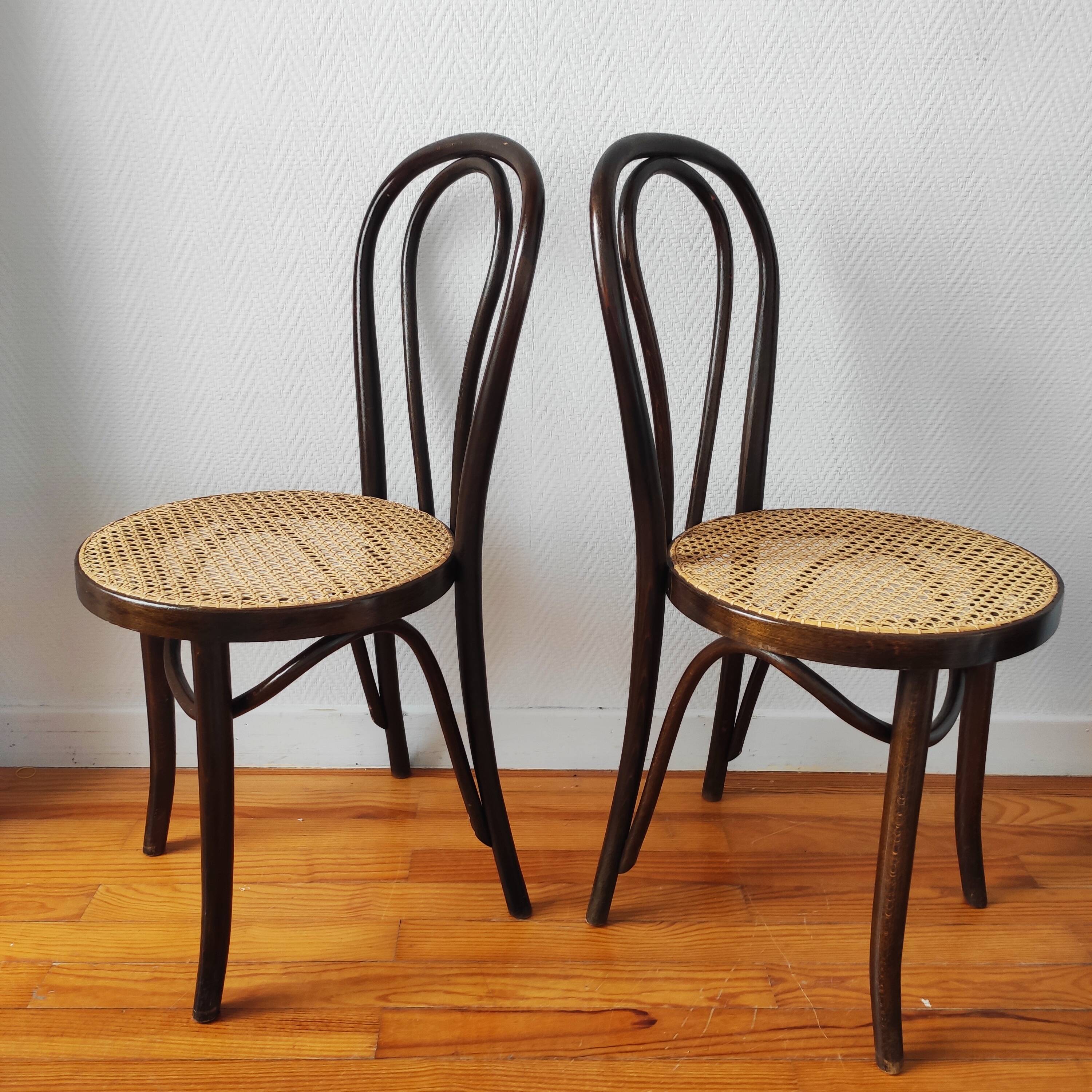 4 antique curved wood and cane chairs