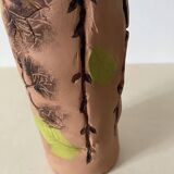 Artisanal pottery set in red clay with harmonious plant motifs