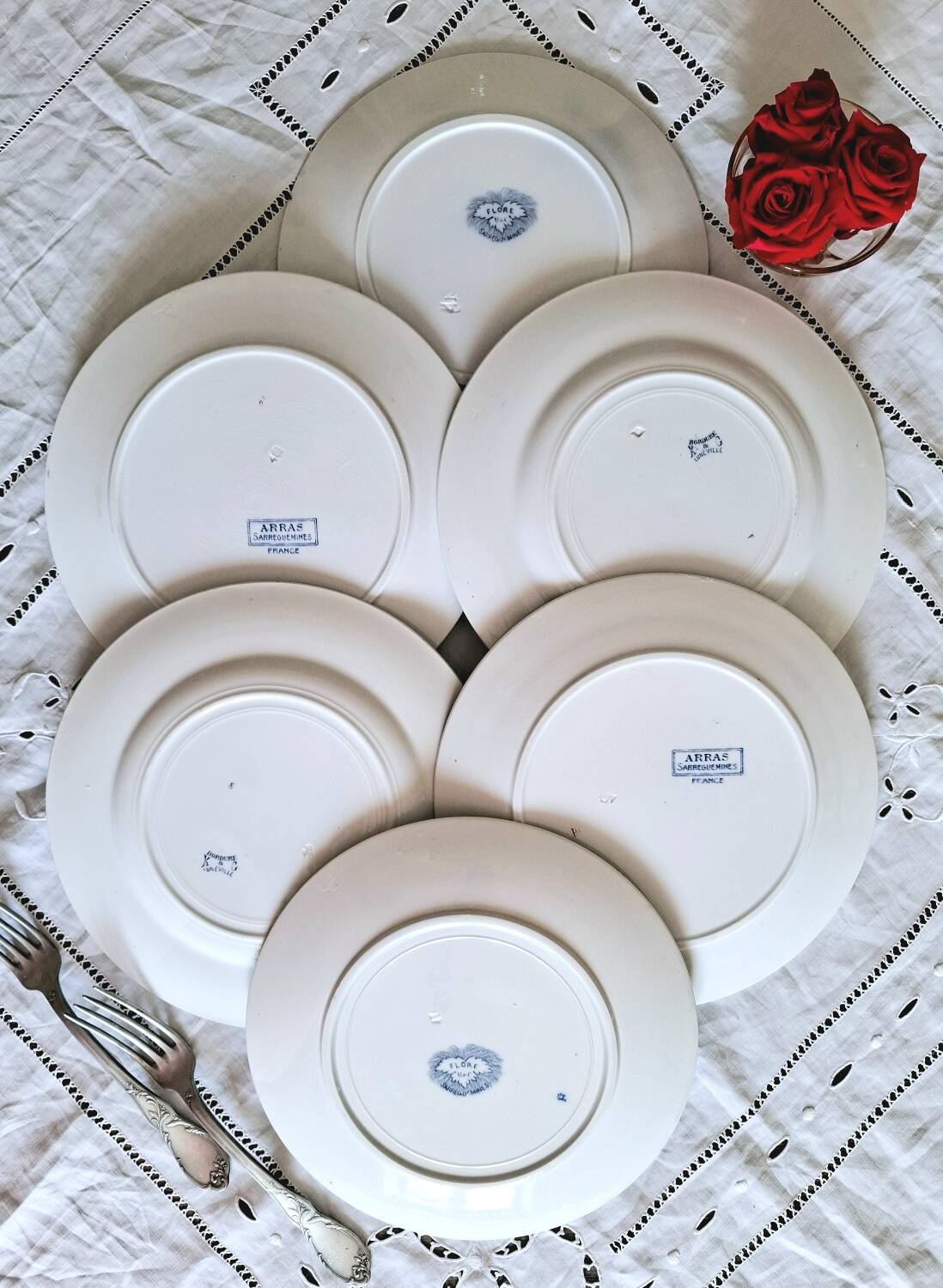 Old mismatched flat plates in iron earth earthenware