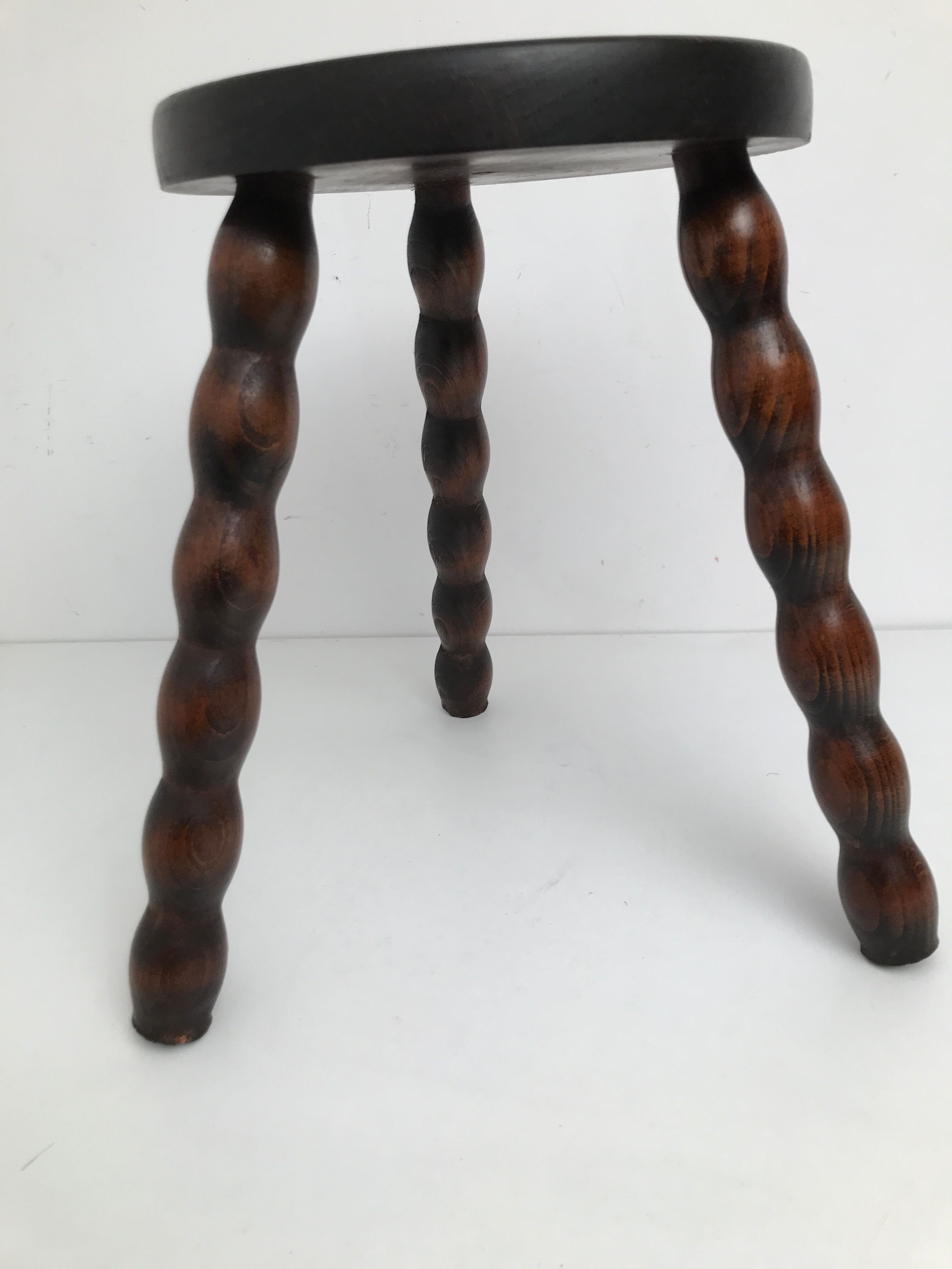 Wooden stool turned tripod foot
