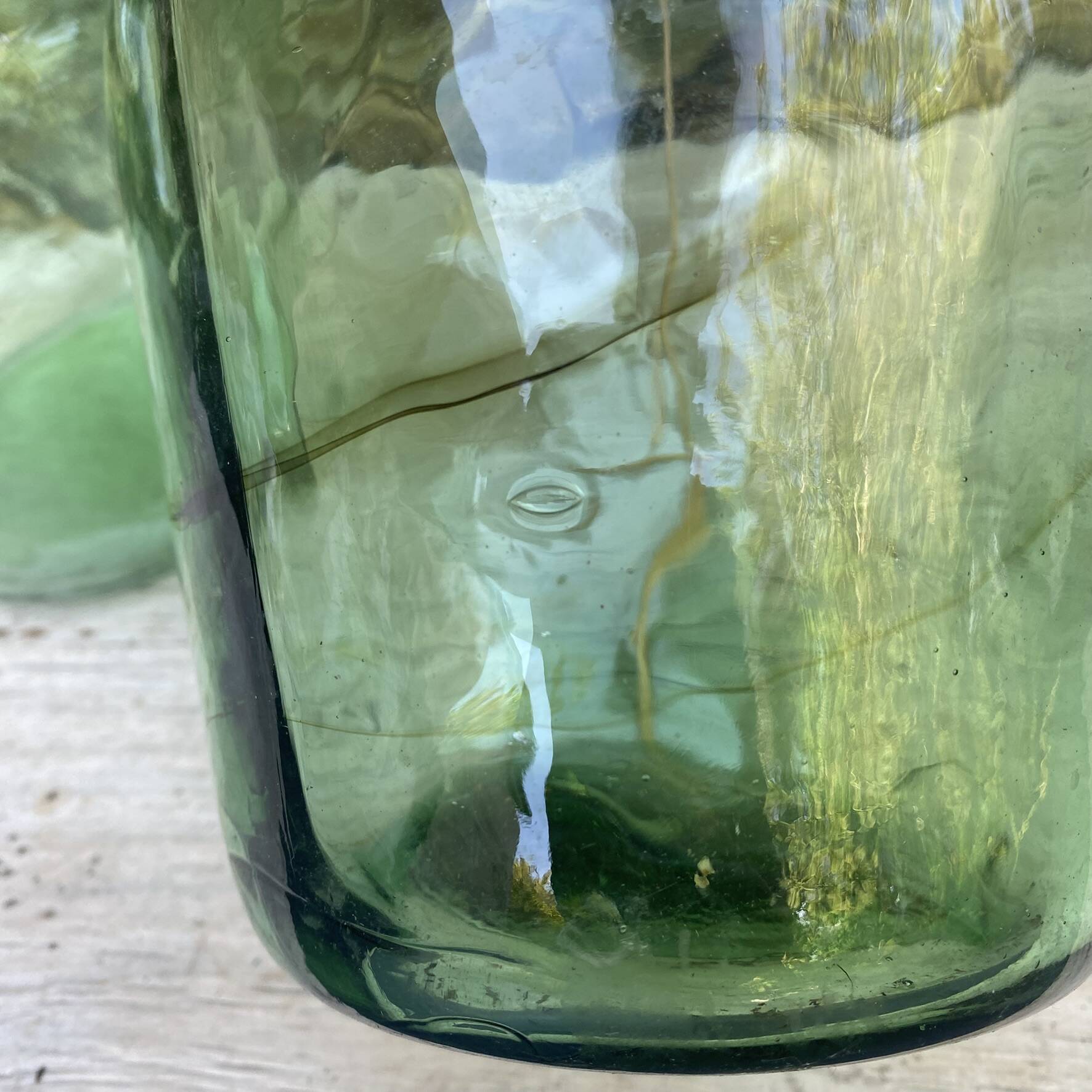 set of tinted glass demijohns