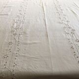 Table service with white handmade embroidery on linen canvas