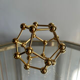 Golden brass atom