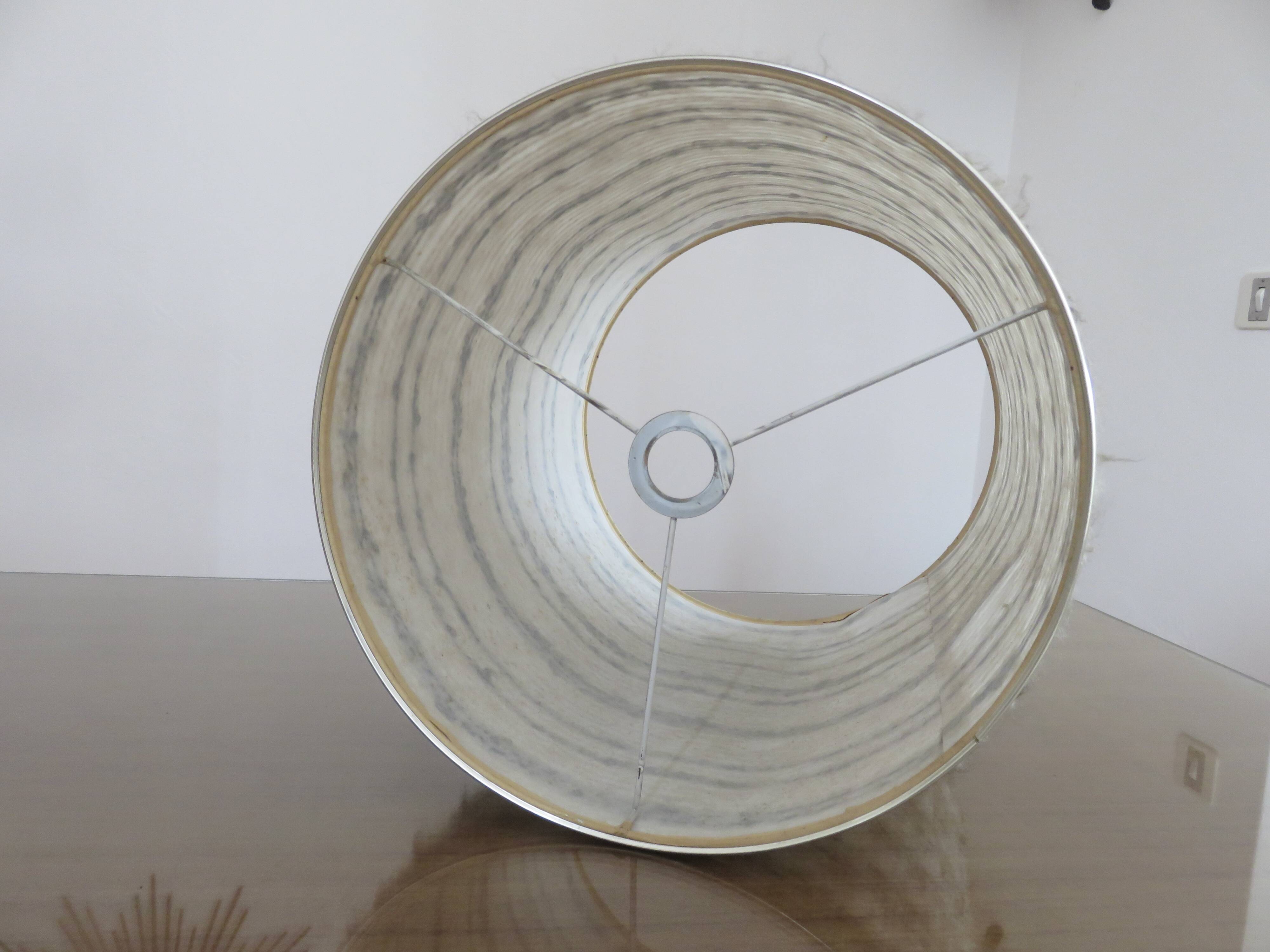 Brushed aluminum and chrome lamp typical of the 70s