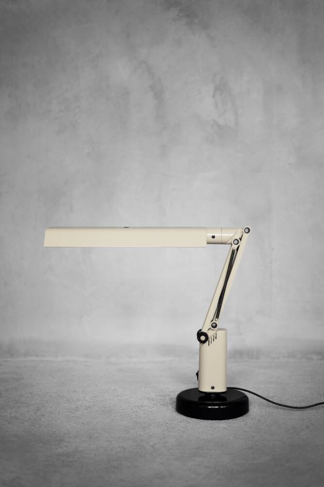 Beige plastic table lamp Lucifer, mid-century modern Scandinavian style.