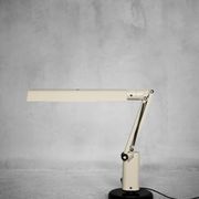Beige plastic table lamp Lucifer, mid-century modern Scandinavian style.