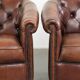 Characterful set of sheepskin club armchairs in English chesterfield style