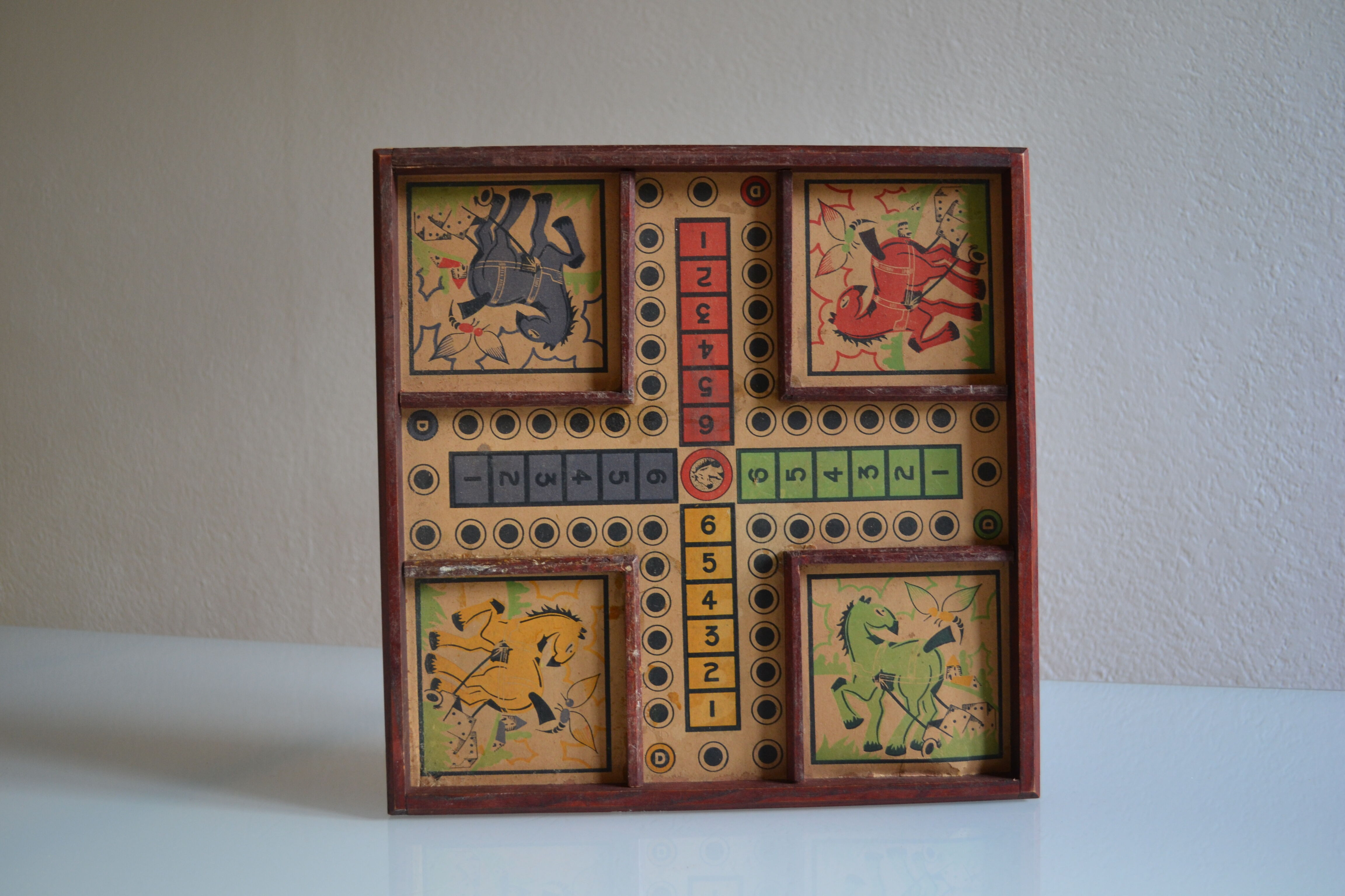 Old game board of small horses